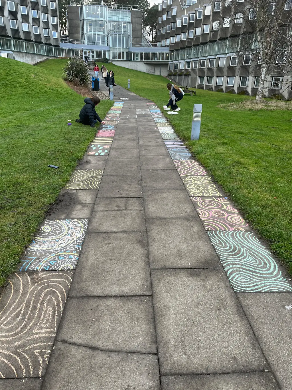 Chalk drawings on the path leading to AMH